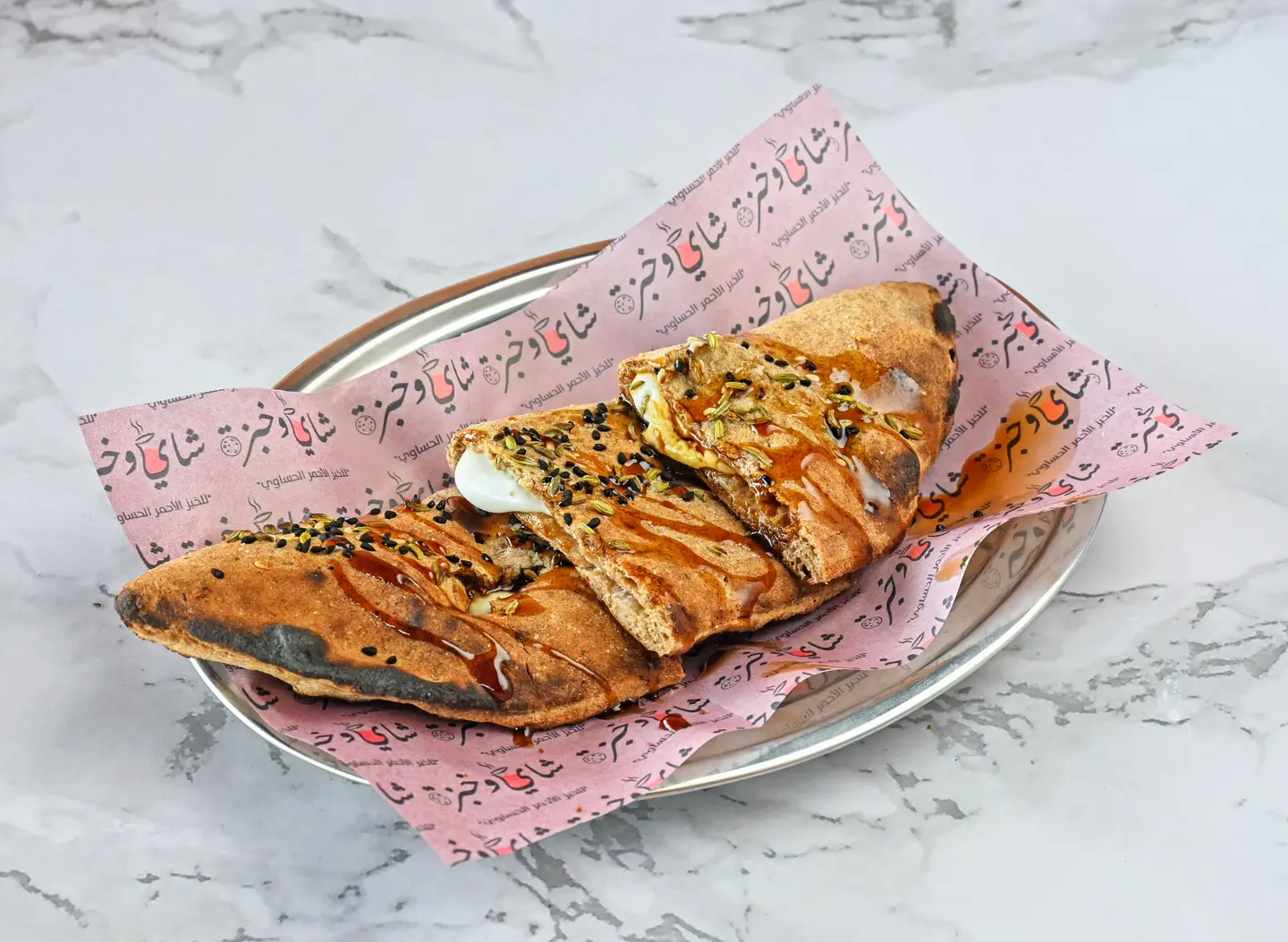 Hasawi Red Bread Sandwich With Labneh And Dates Cream