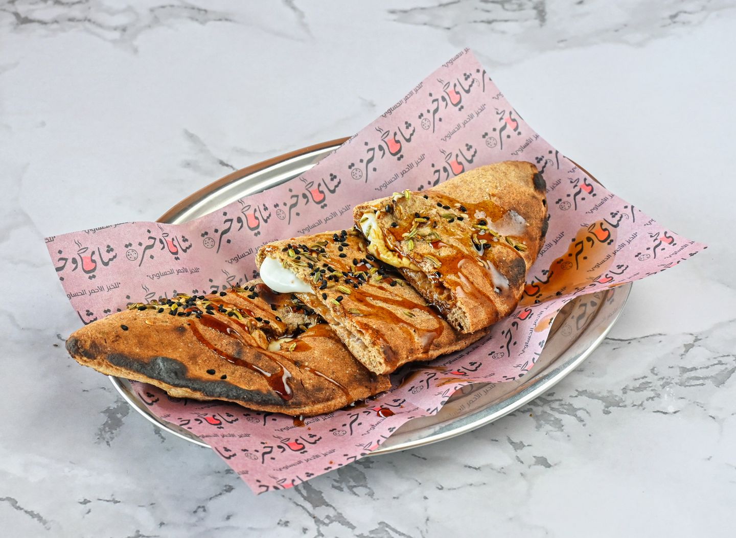 Hasawi Red Bread Sandwich With Labneh And Dates Cream