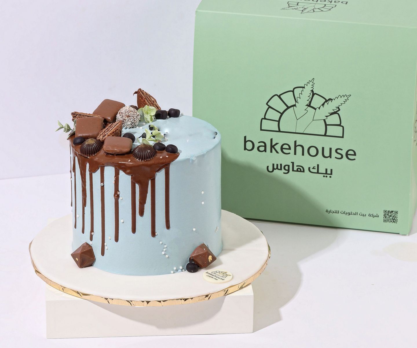Light Blue Cake With Melted Chocolate Decoration