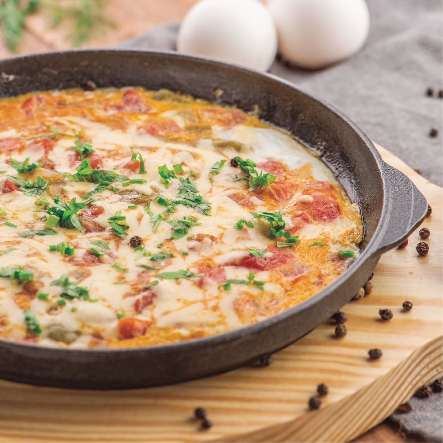 Tomato Frying Pan With Eggs And Moz Zarella Cheese
