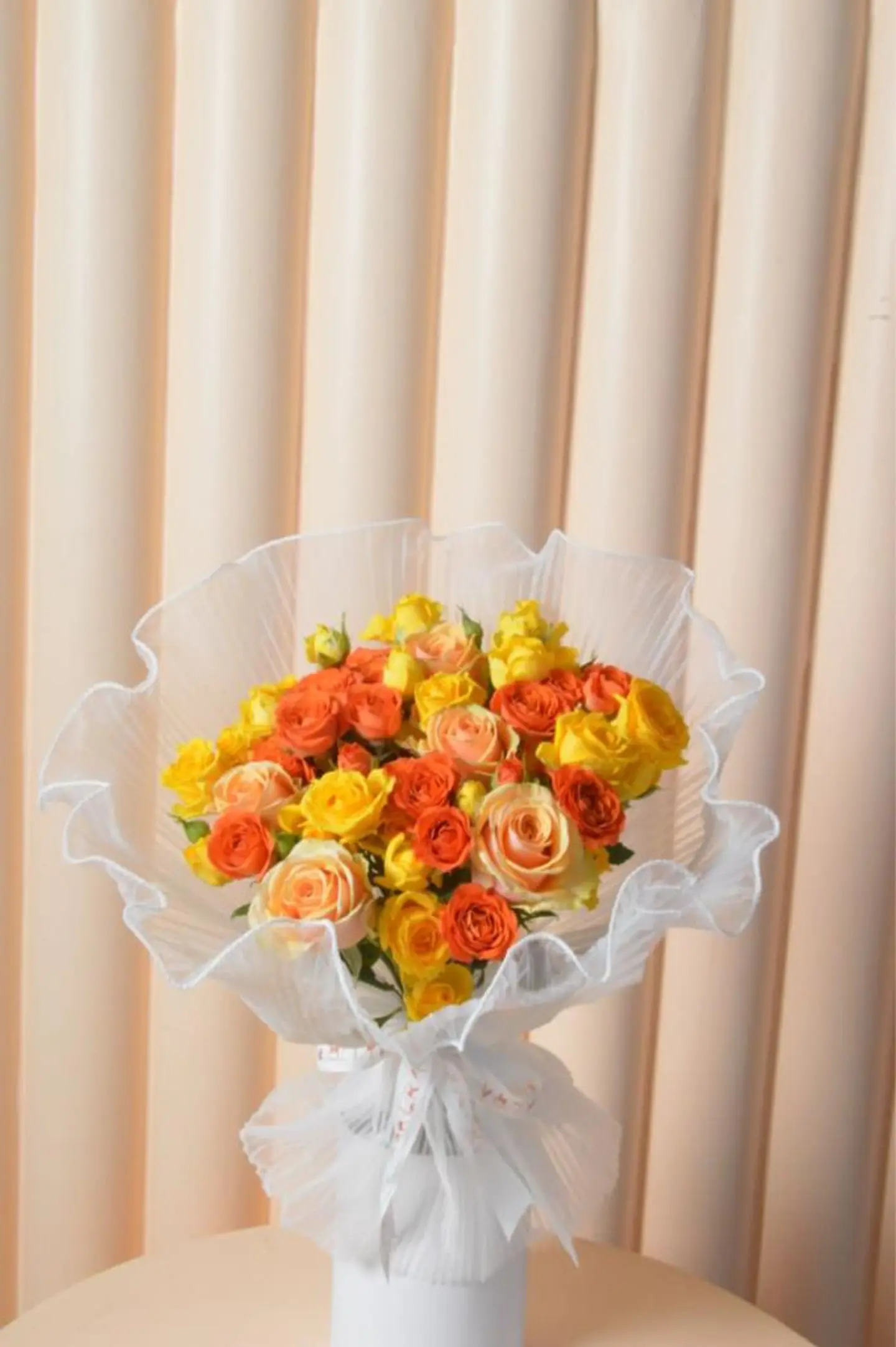 Yellow And Orange Mix Bouquet With White Fabric Wrapping