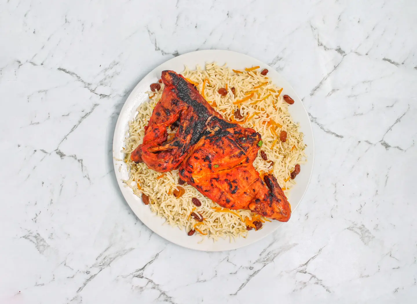 Half A Piece Of Chicken On Charcoal With Rice