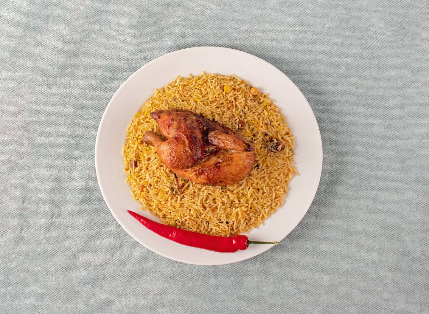 نص حبة دجاج شواية حرّاق مع أرز بسمتي برياني