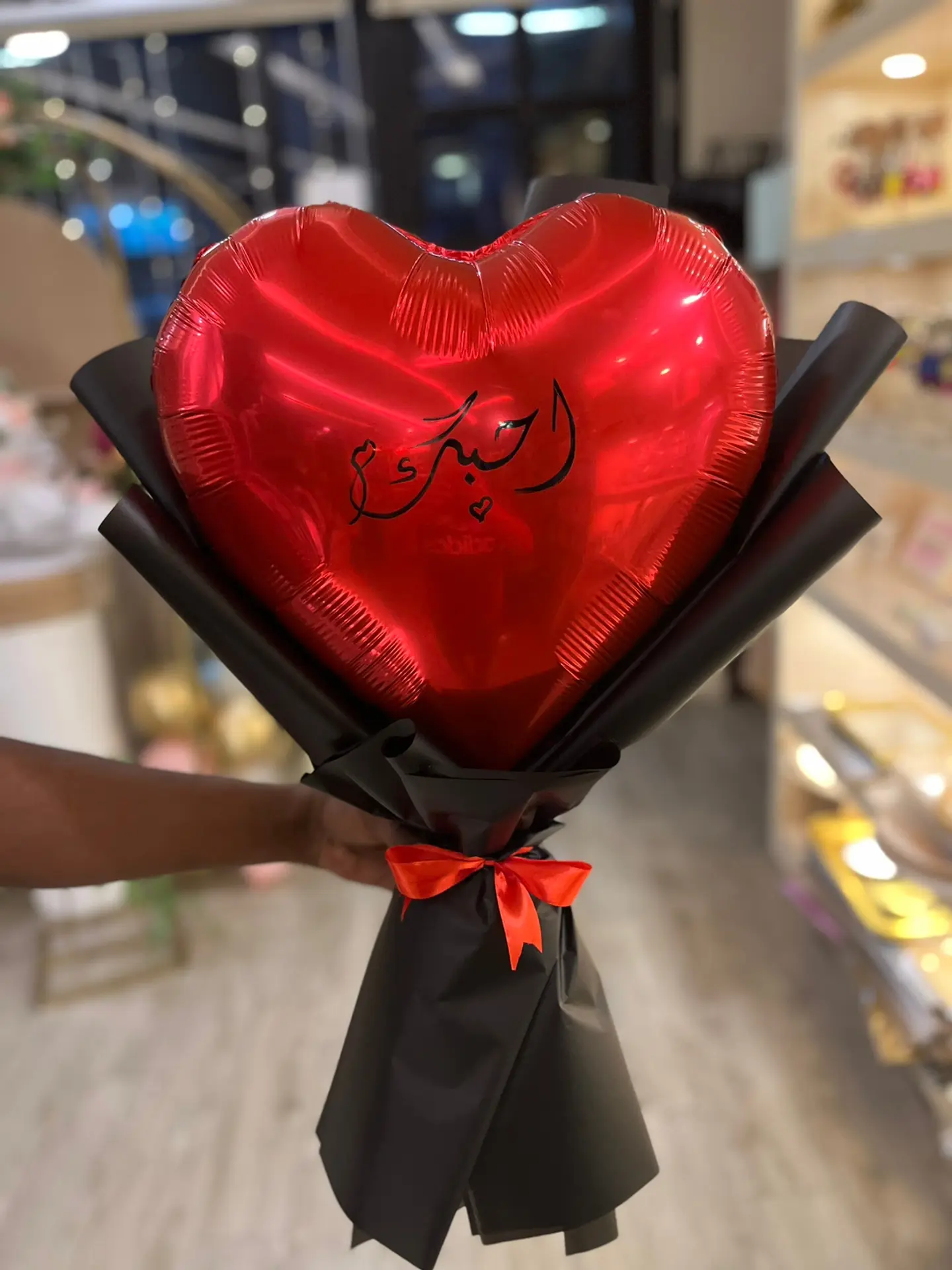 A Heart Shaped Balloon With The Writing I Love You