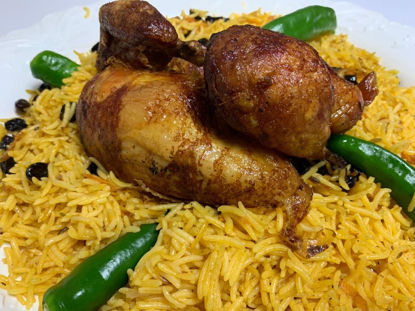 نصف دجاجة شواية مع الأرز
