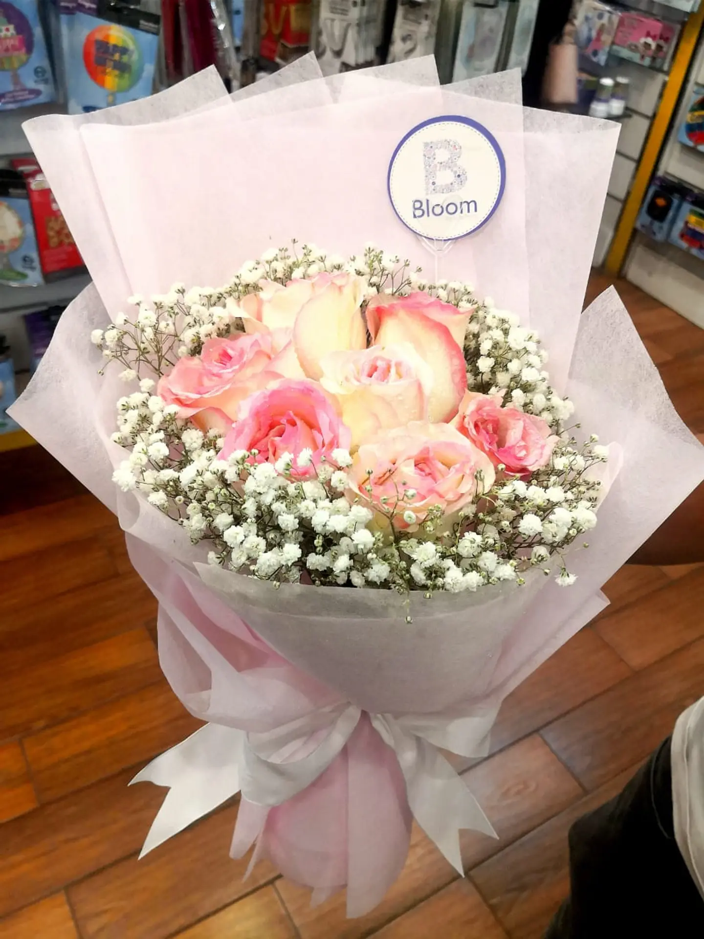Round Bouquet Of Pink Roses With Baby Breath