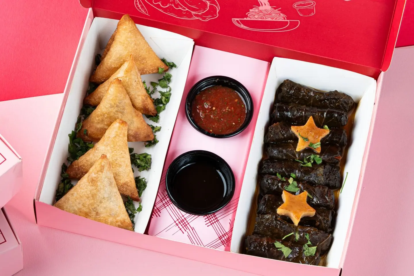 A Box Of Grape Leaves And Samosas - 25 Pcs