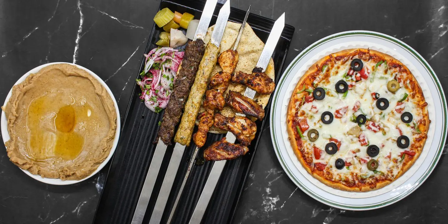 مطعم تتبيلة الواحة cover