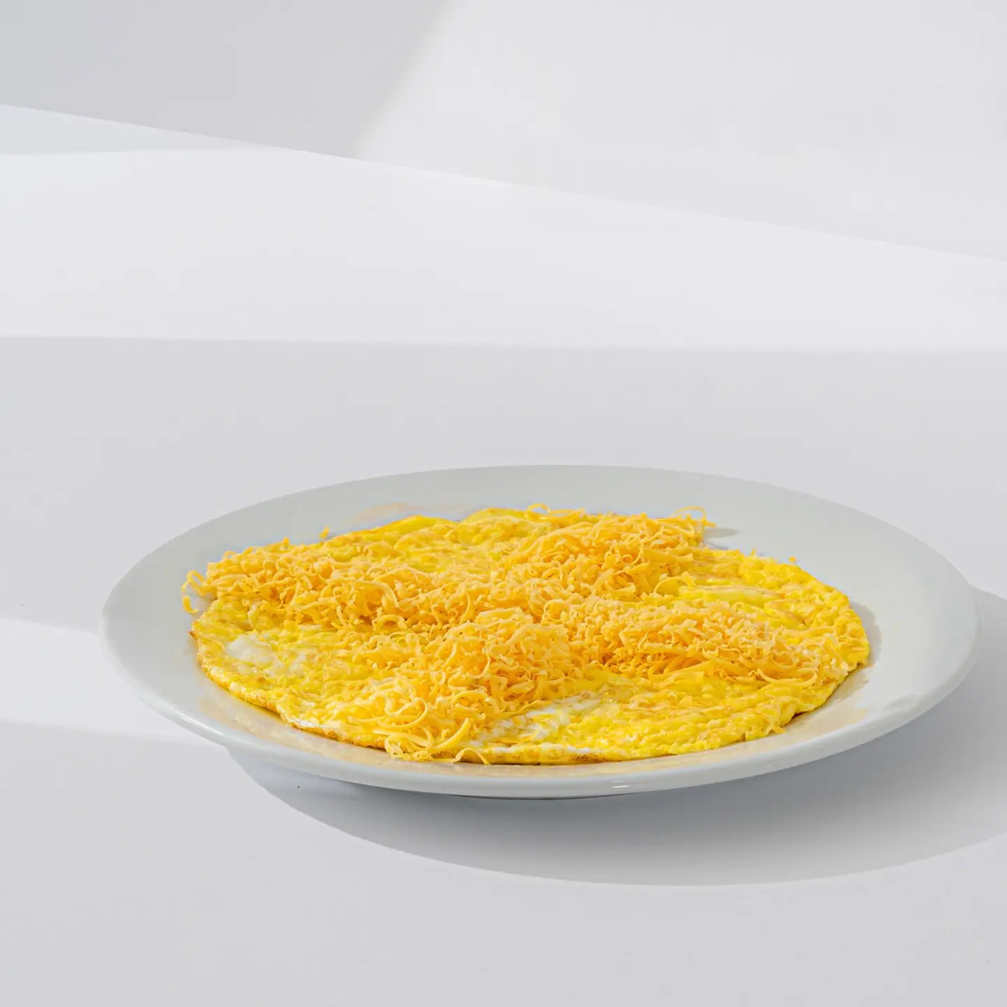 Fried Eggs With Cheddar Cheese