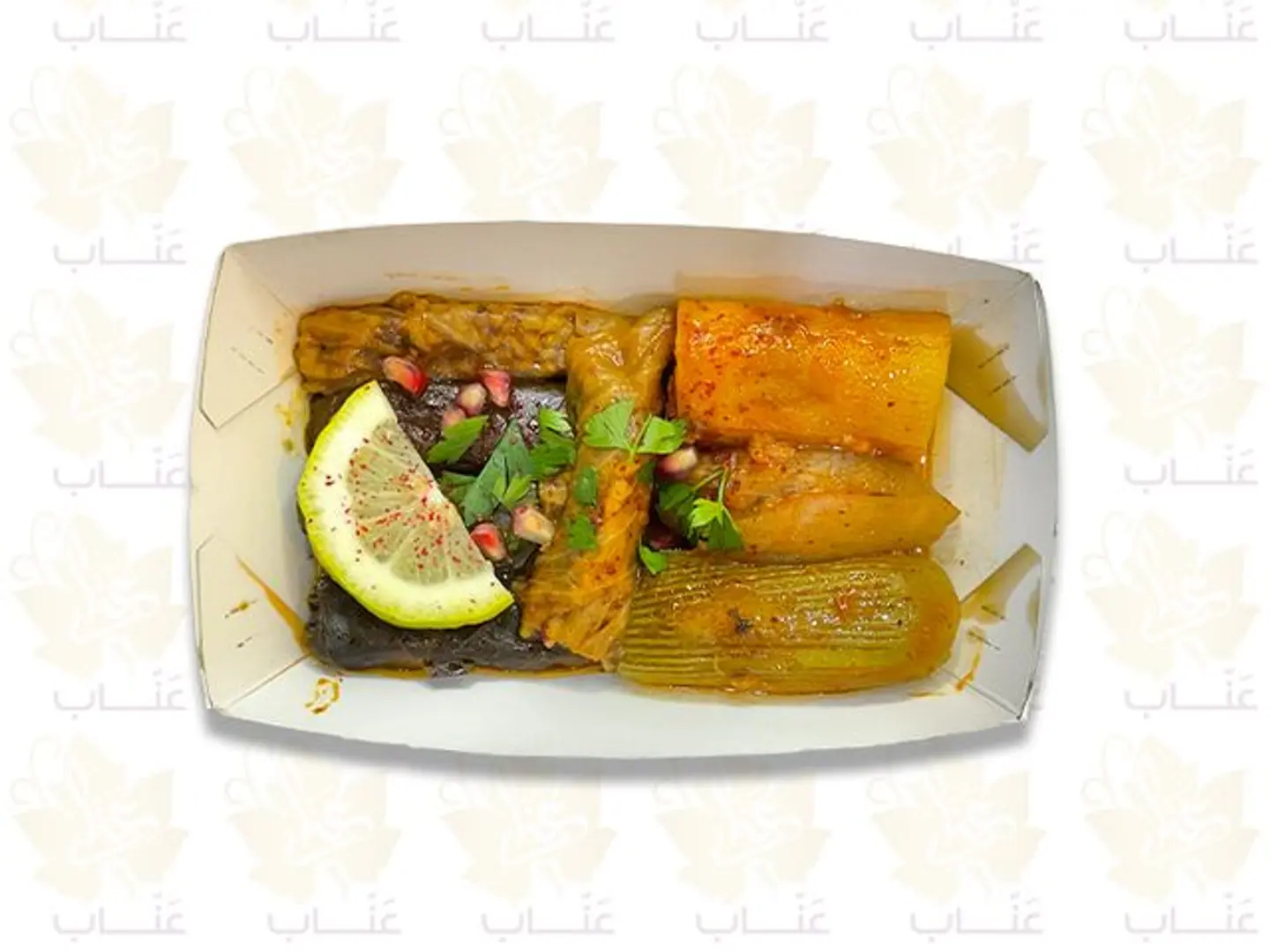 A Small Box Of Stuffed Grape Leaves And Assorted Stuffed Vegetables