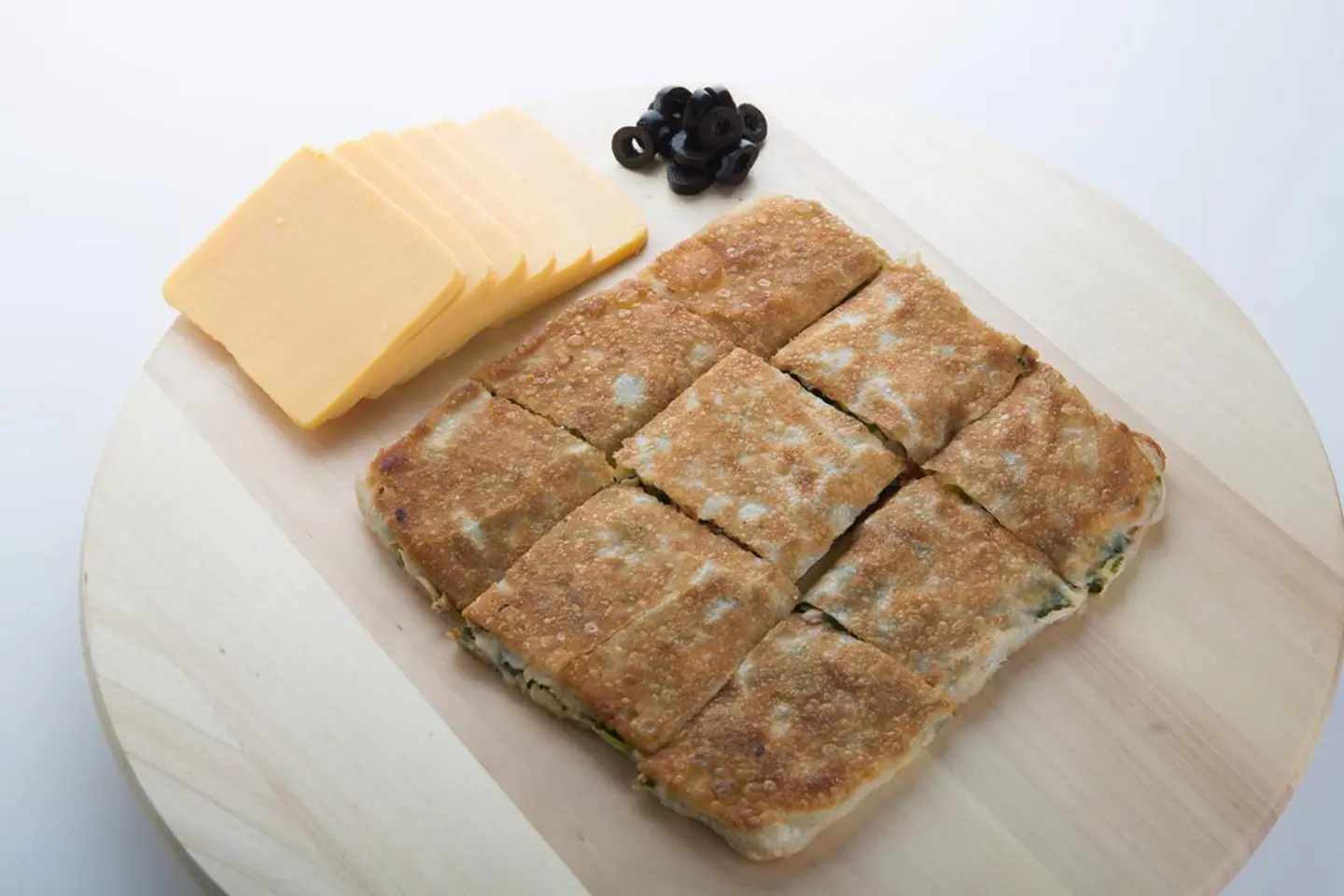 Cheddar Cheese Motabaq With Olive Slice