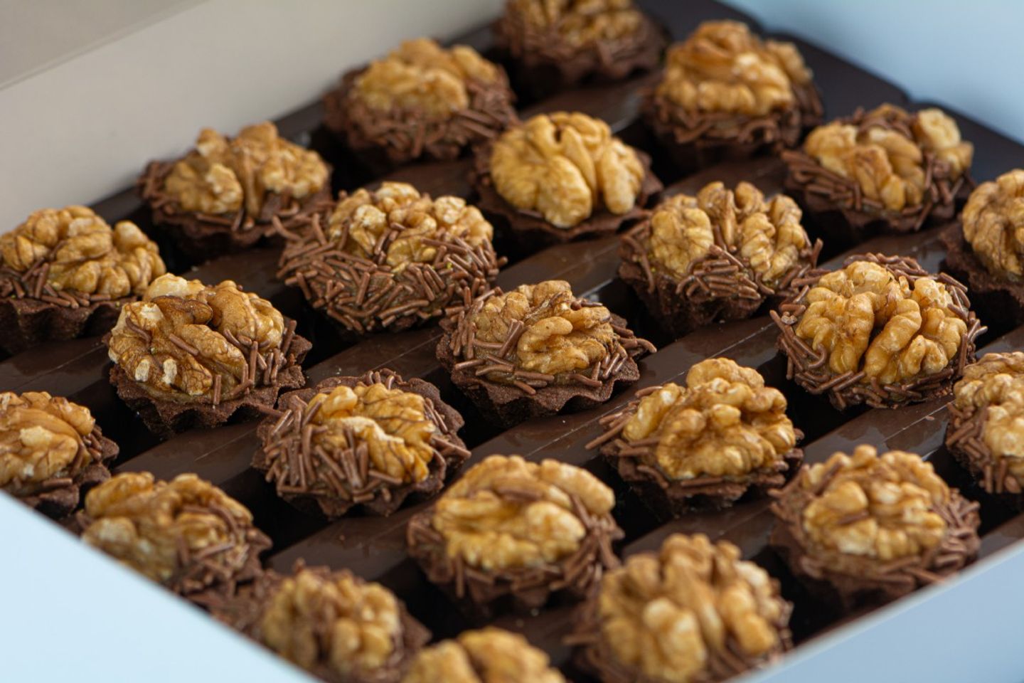 Mini Tart Stuffed With Dates Covered With Walnuts