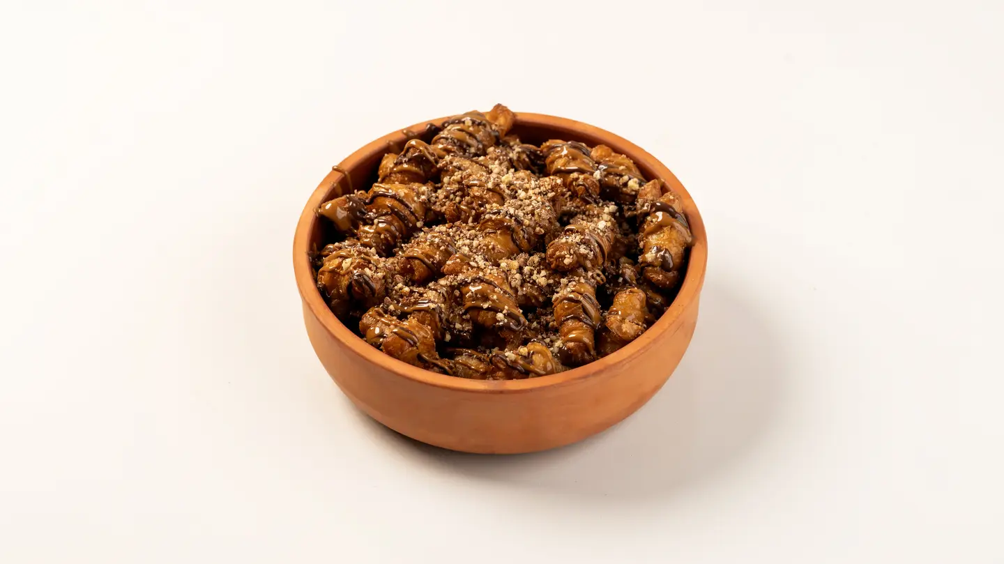 Mini Croissant Stuffed With Cheese, Topped With Chocolate And Caramel Sauce