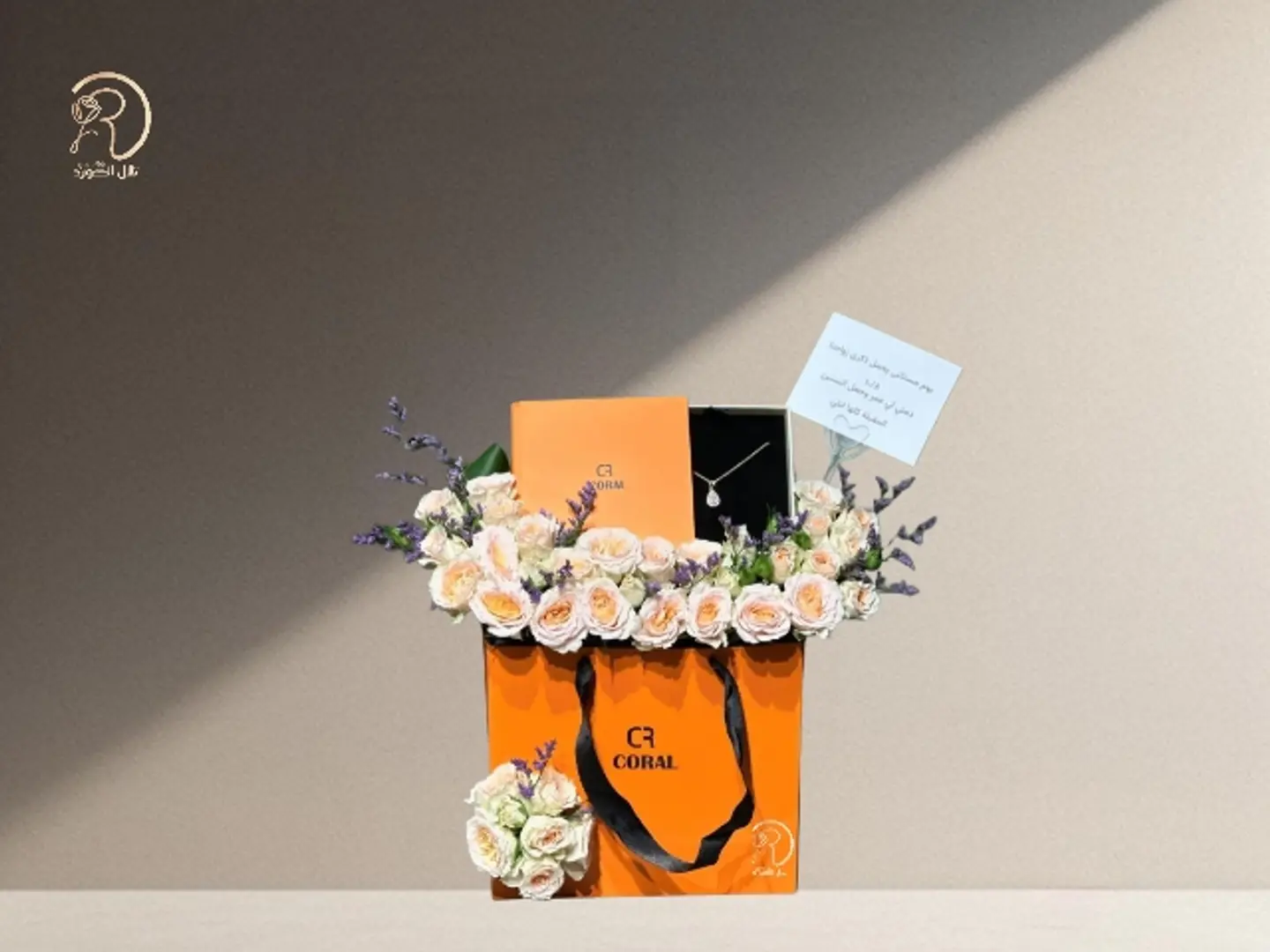 Arranged With A Sparkling Rose Box And A Distinctive Coral Necklace