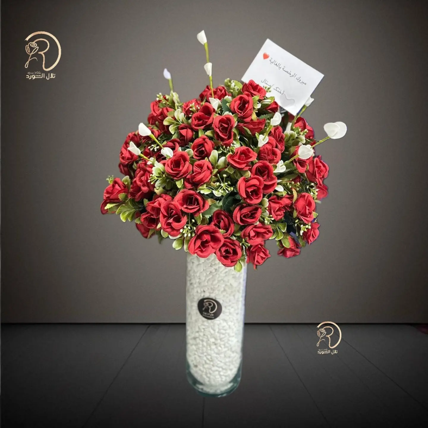 An Elegant Glass Vase With An Artificial Flower Arrangement That Increases The Charm Of Any Corner Of The House