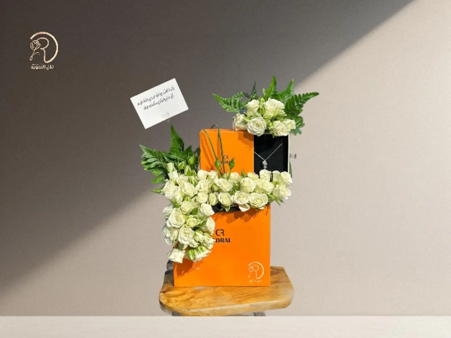 An Arrangement That Combines Coral And Elegant Roses