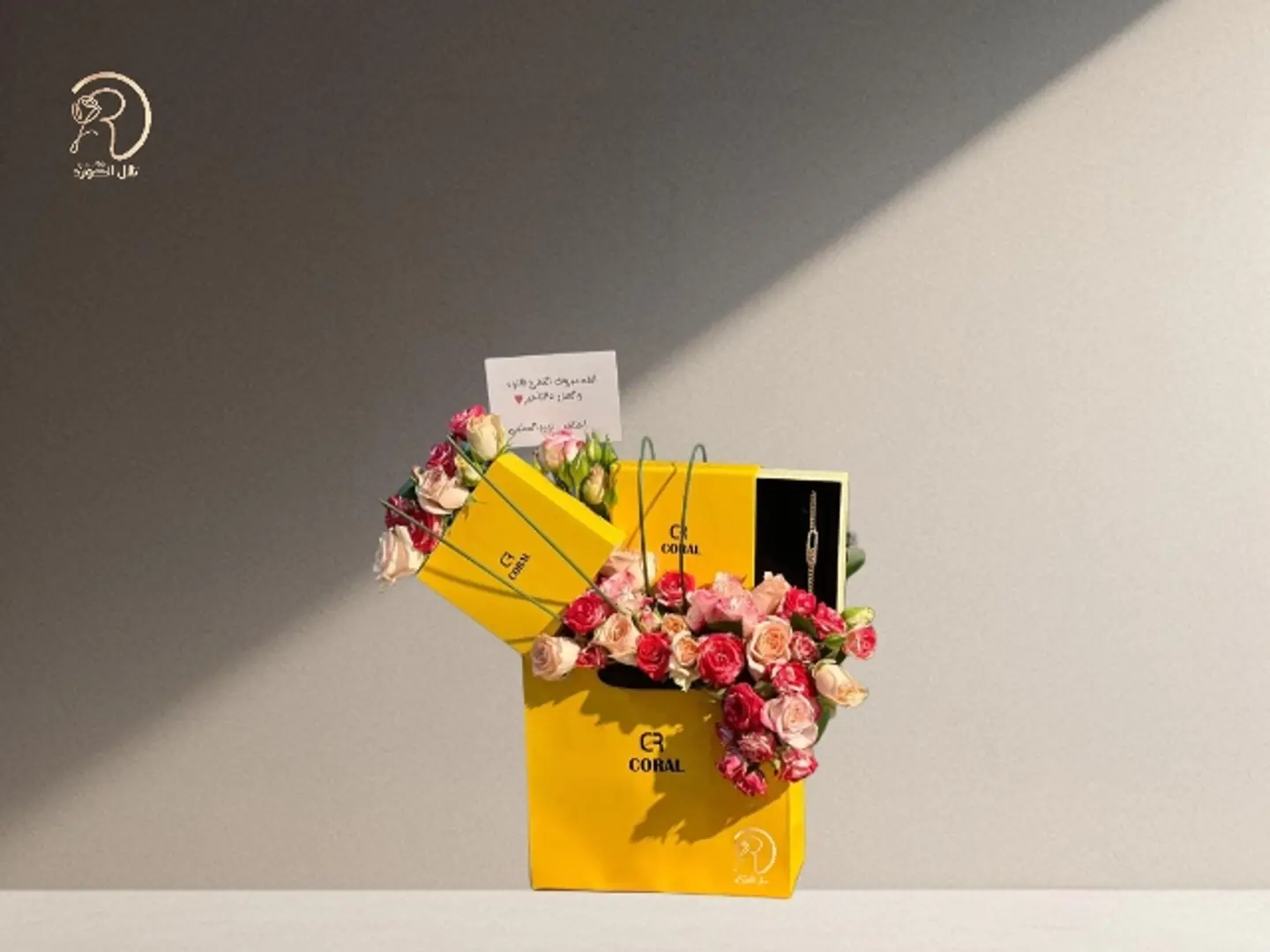 Elegant Box Arrangement Of Roses And A Coral Necklace