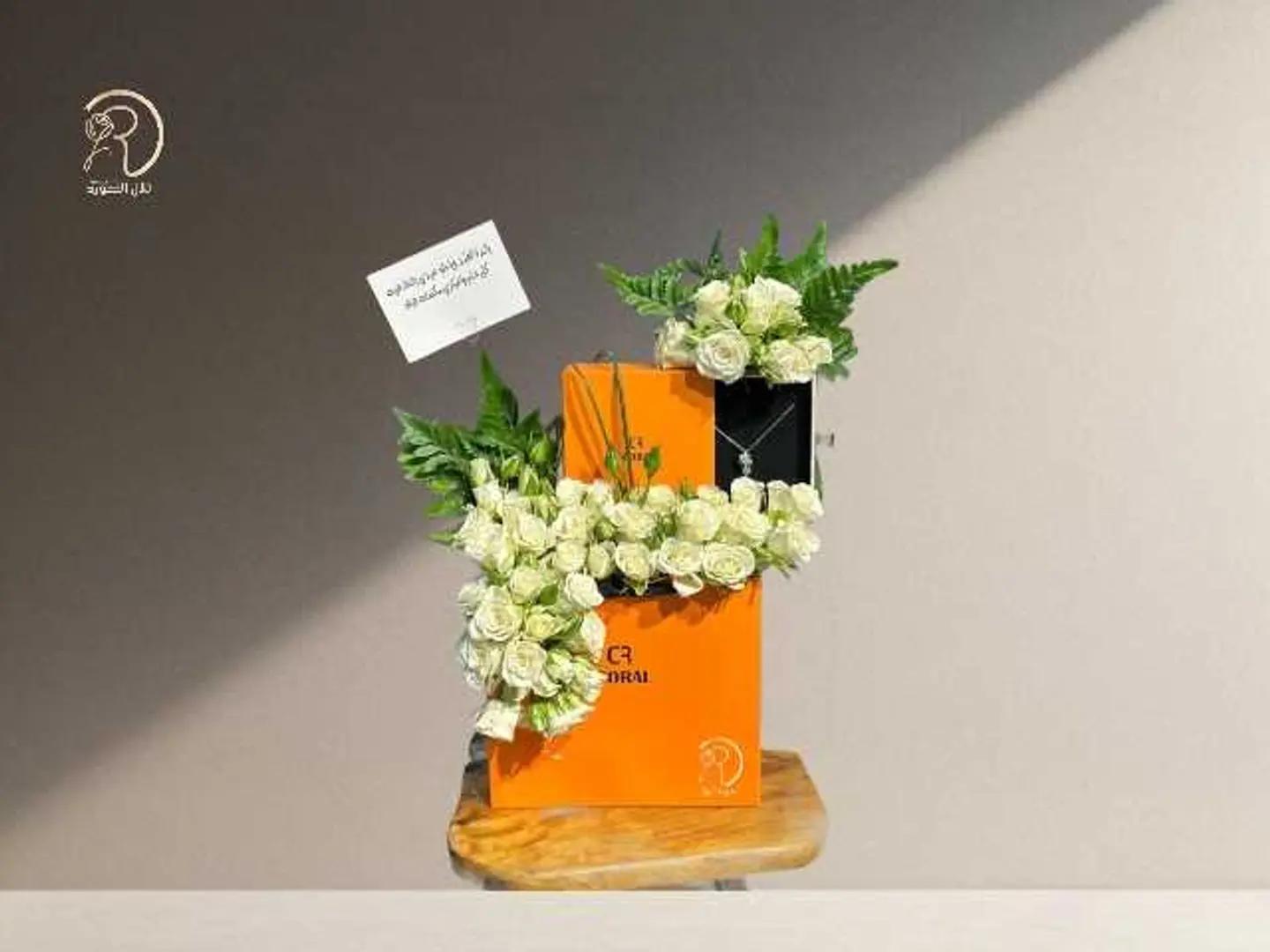 An Arrangement That Combines Coral And Elegant Roses