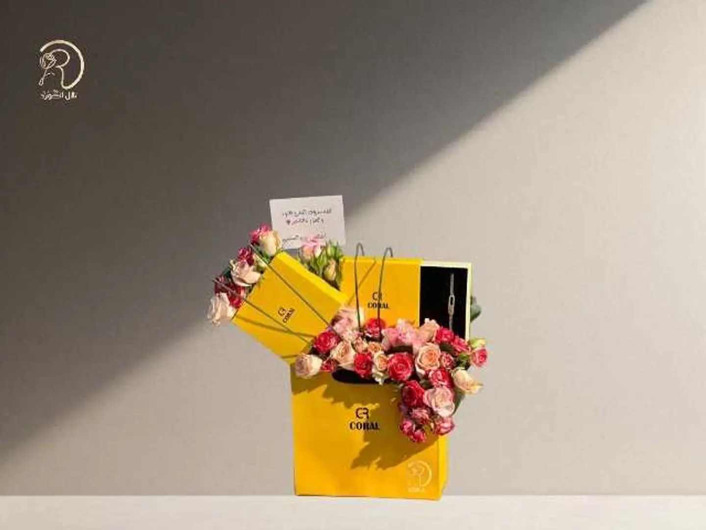 Elegant Box Arrangement Of Roses And A Coral Necklace