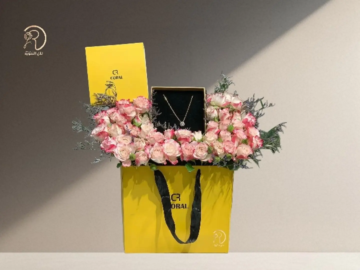 Love And Elegance Box Arrangement Of Pink Roses With Coral Brand