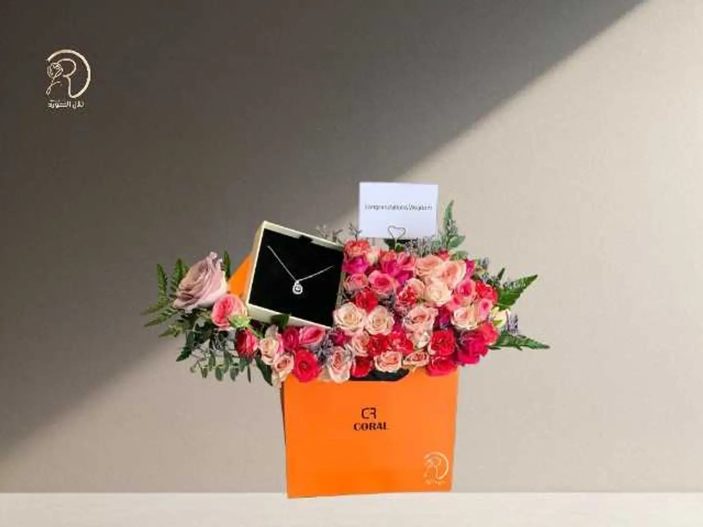 A Harmonious Box Arrangement Of Roses Feelings And A Necklace From Coral