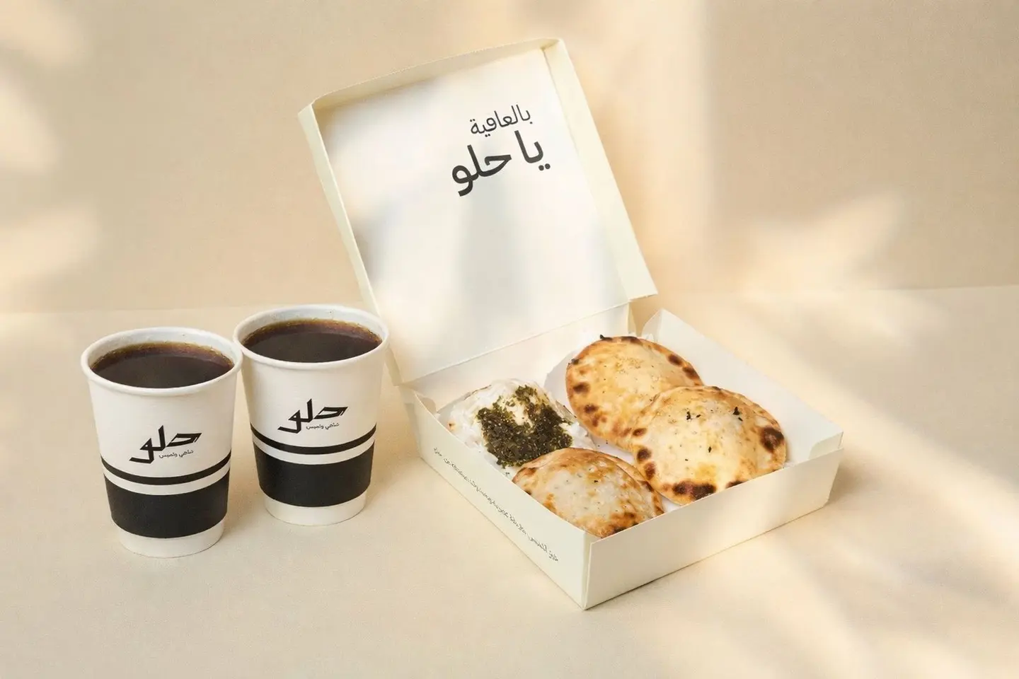 A Box Of 4 Pieces With Two Cups Of Tea