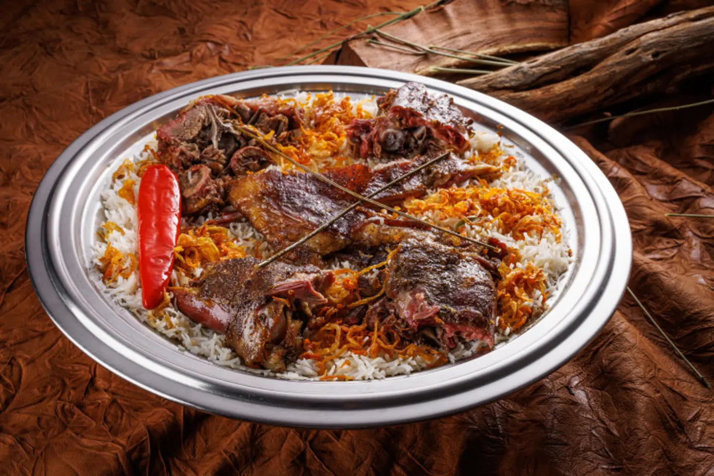 ربع ذبيحة تيس حنيذ مدخن مع الرز