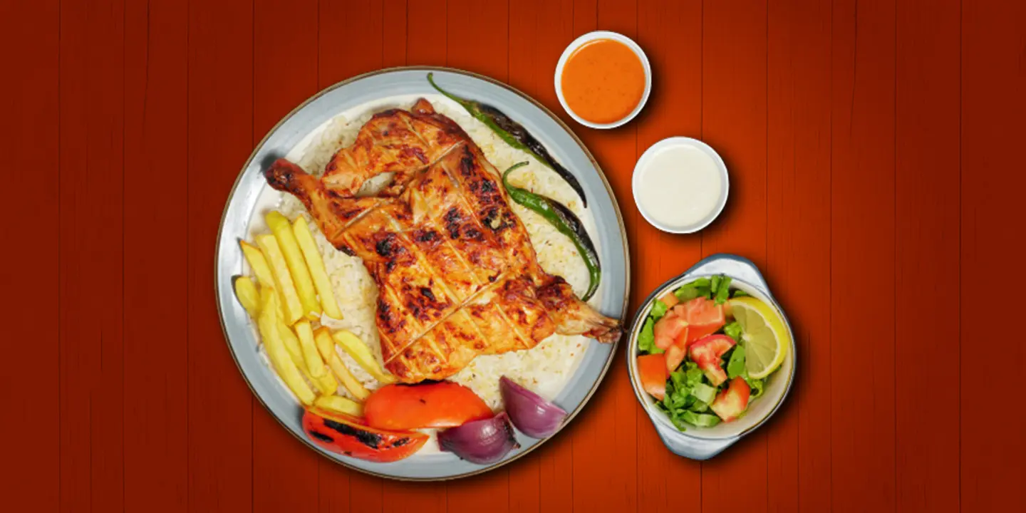 نصف حبة دجاج عالفحم مع أرز