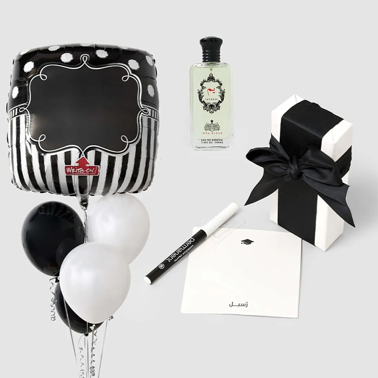 هدية تخرج عطر إرث للعود مع باقة بالون