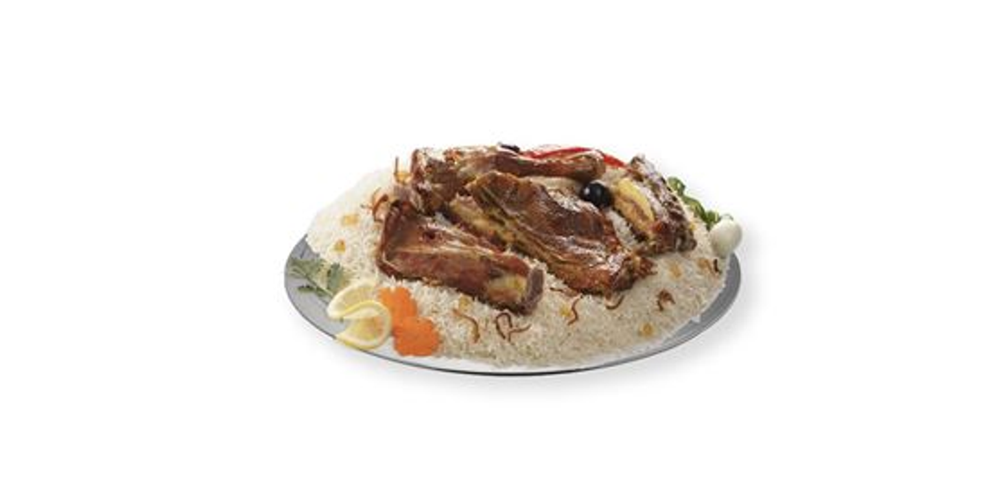 A Quarter Of A Mandi Goat With Peshawar Rice With Plate