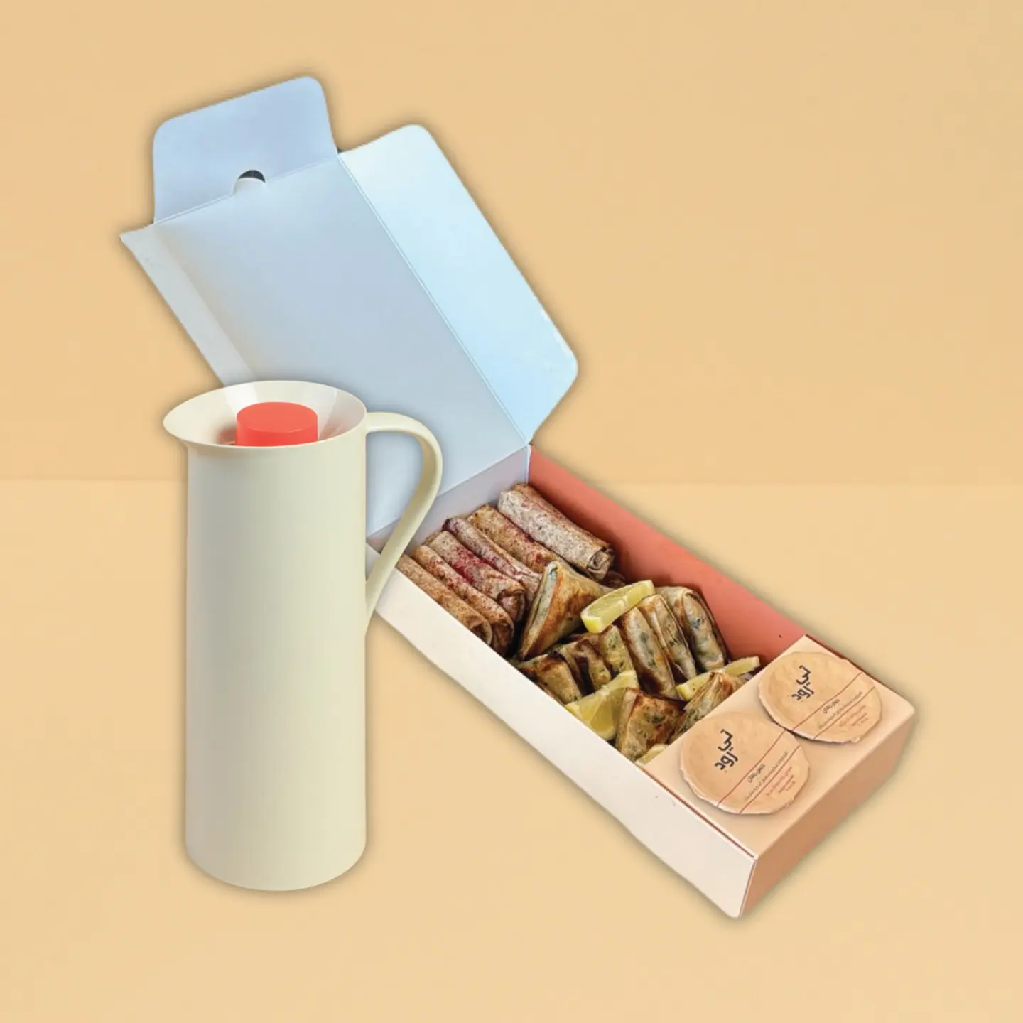 A Small Box Of Samosas And Musakhan With A Liter Of Drink.
