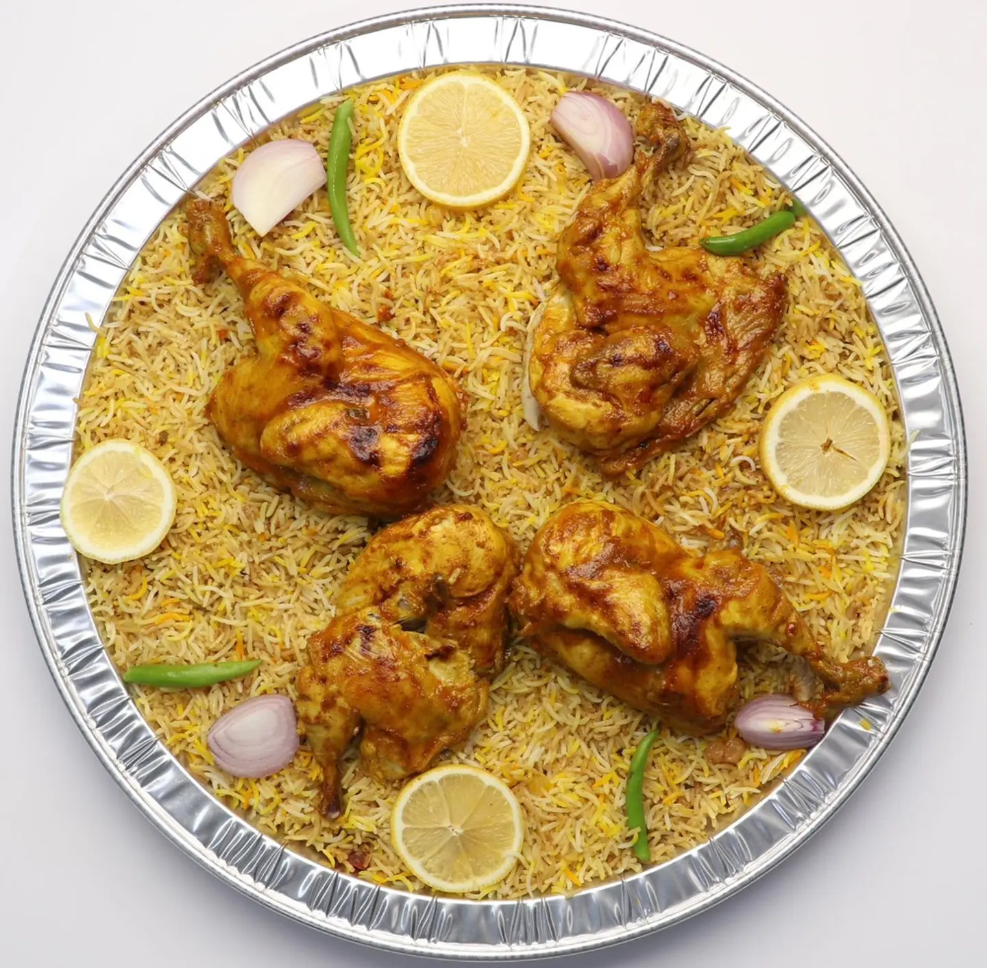 Two Oven Baked Chicken Pieces One Plate Of Biryani Rice