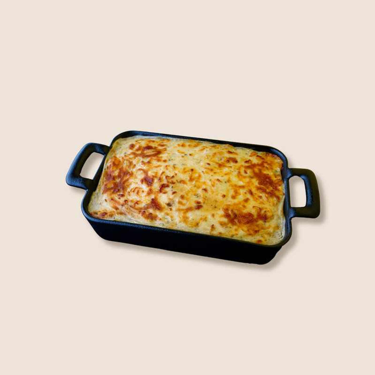 A Tray Of Red Pasta With Cheese