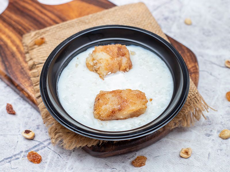 Rice Pudding With Basbousa And Nuts And Ice Cream