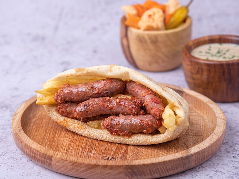 Baladi Bread Sausage With French Fries Sandwich