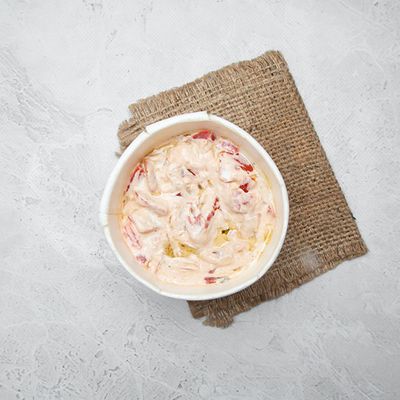 Cheese box with tomatoes and tahini