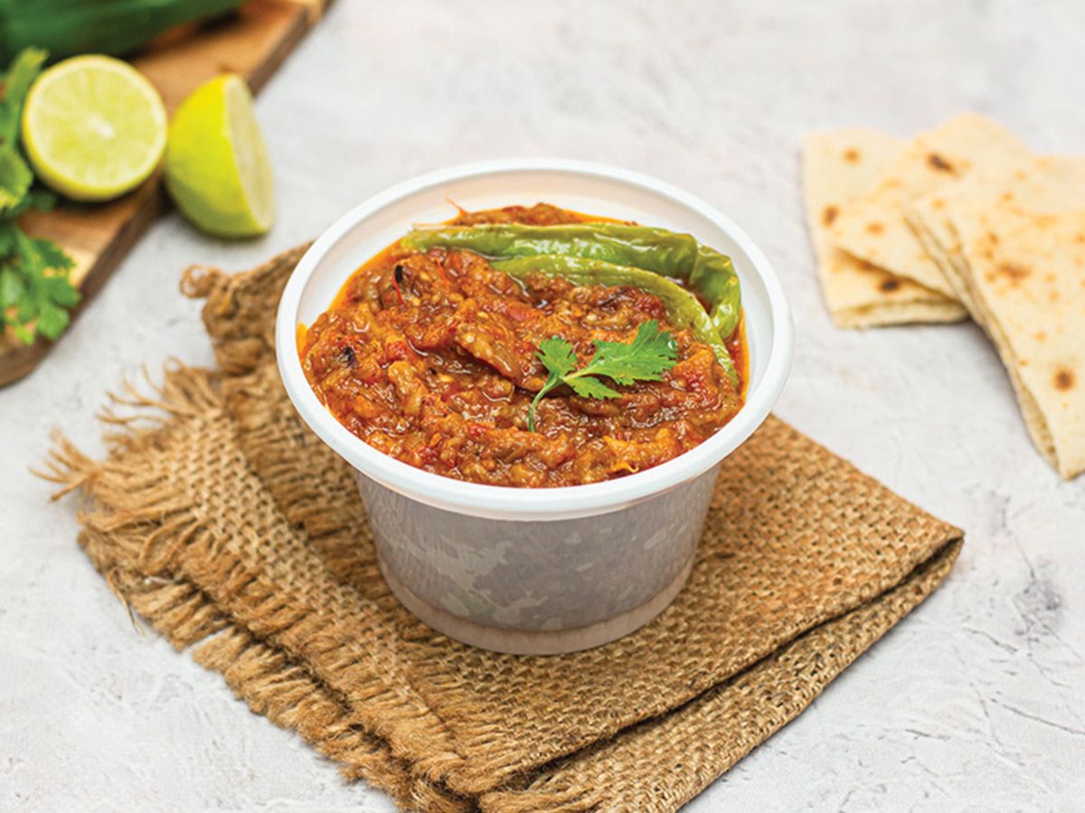A Box Of Moussaka With Sauce