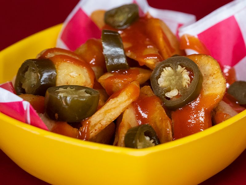 French Fries With Cheese And Jalapeno Sriratcha Sauce