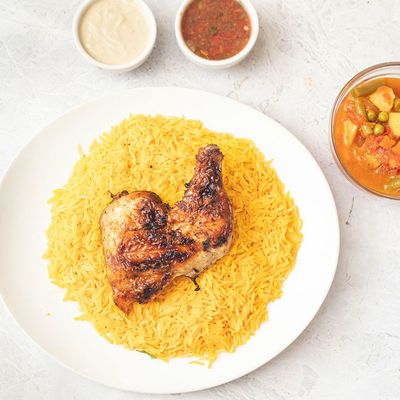 ربع دجاجة مع أرز وخضروات