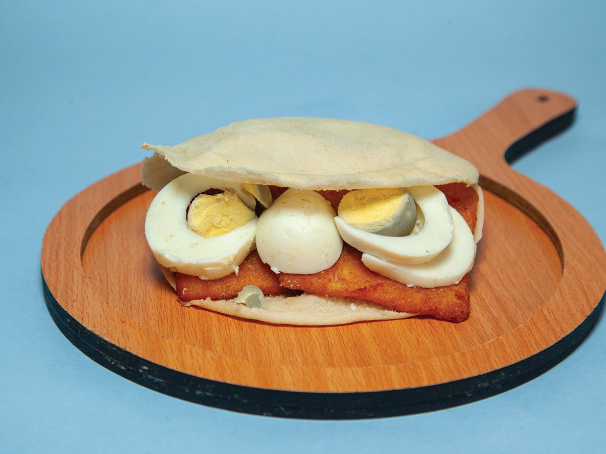 Fried cheese with fried eggs sandwich