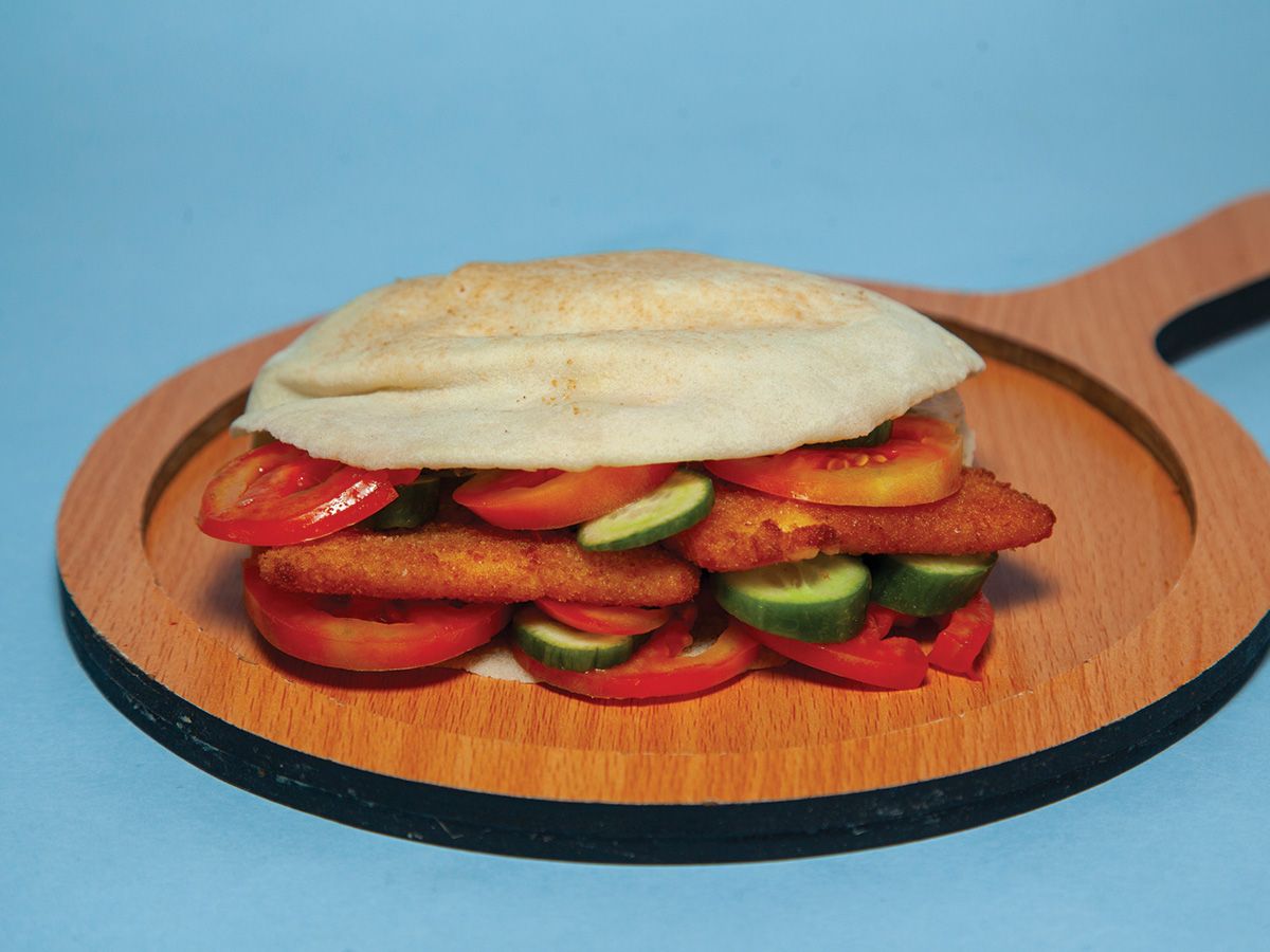 Fried cheese with tomato and cucumber sandwich