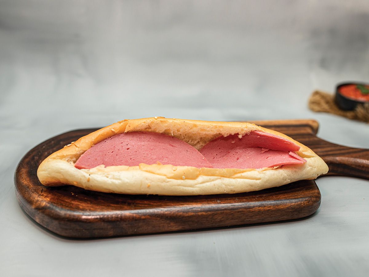 Triangle cheese sandwich with Halawani luncheon