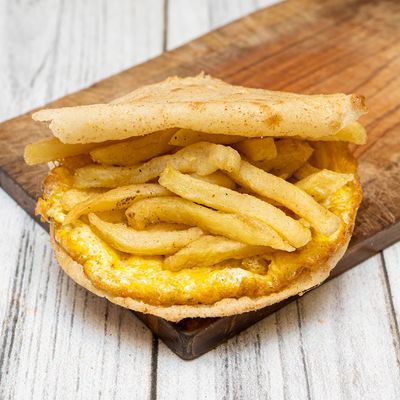 fingers on omelet sandwich
