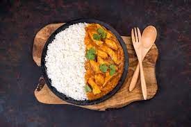 Fillet in curry sauce with white rice and vegetables