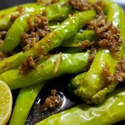 A box of bell peppers and fried chili peppers