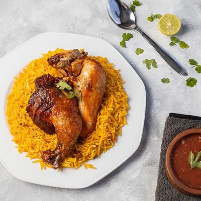 Half Kabsa chicken with rice and sauce