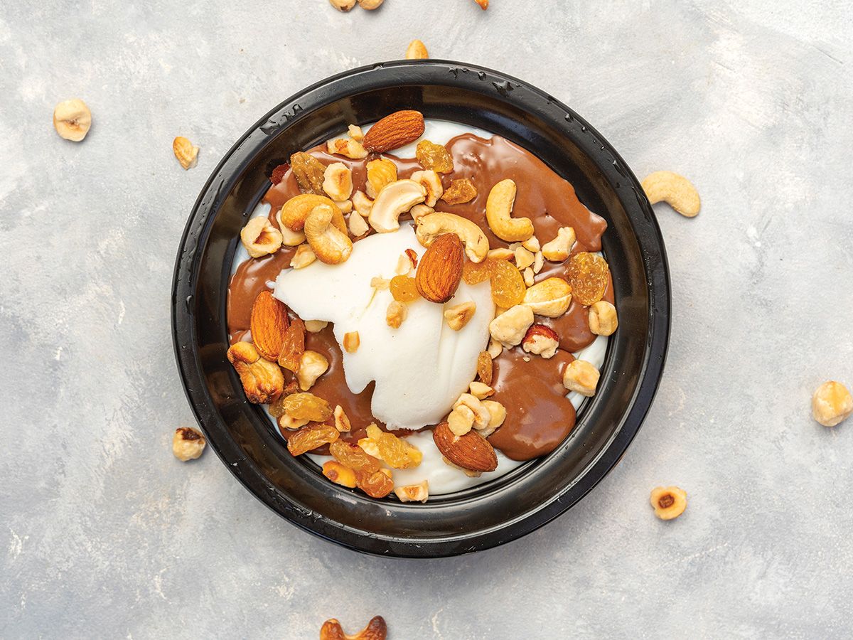 Rice pudding with nutella, ice cream and nuts