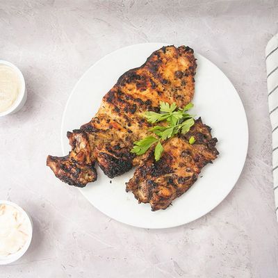 Large crispy boneless meal with rice and potatoes