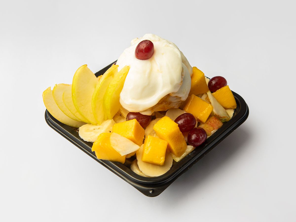 Rice pudding with ice cream and fruit salad