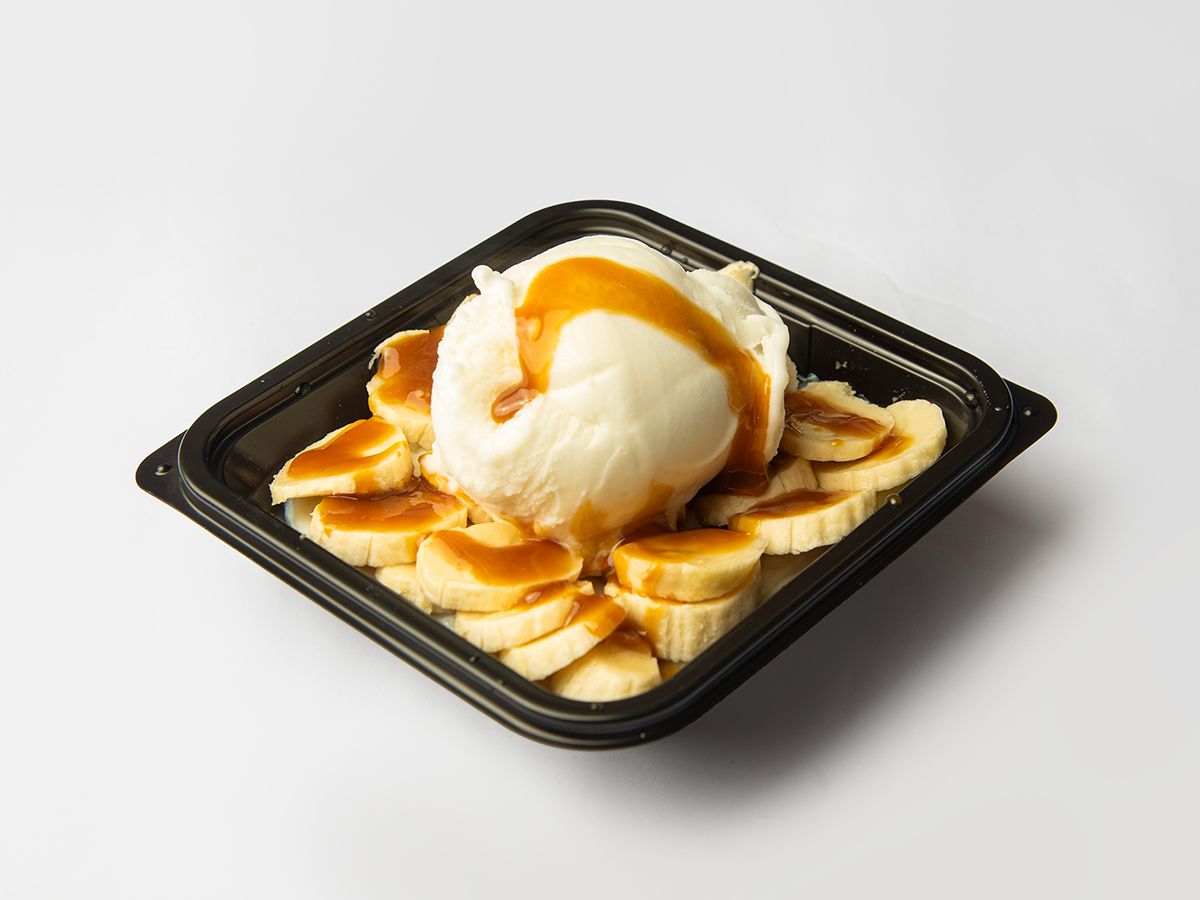 Rice pudding with ice cream, banana, and caramel sauce